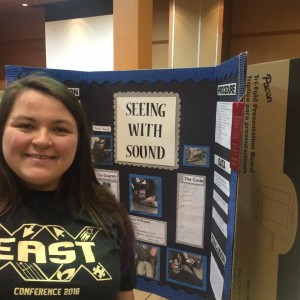 Senior Olevia Hughes with her Science Fair project.
