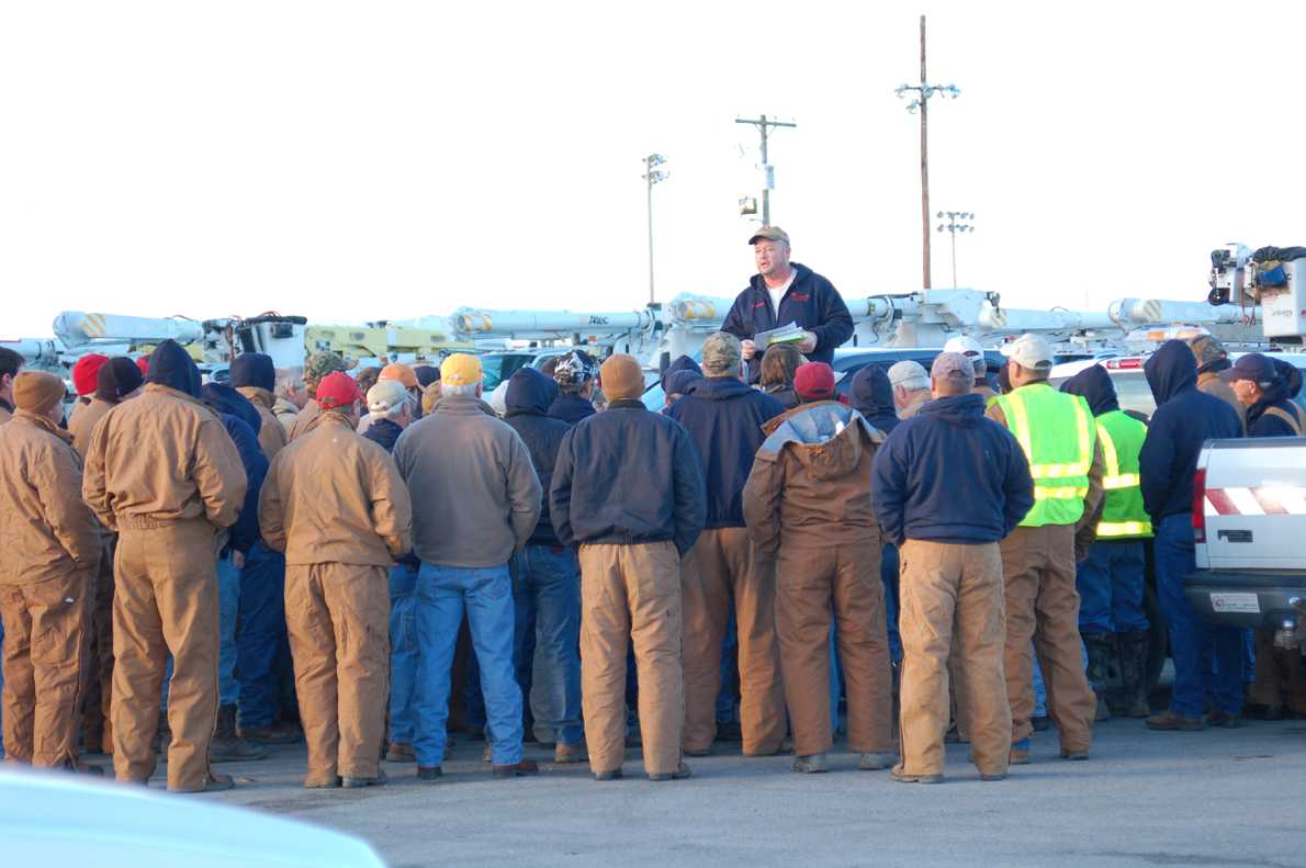 Entergy workers receive instructions before heading out to restore power to local residents on Feb. 2.