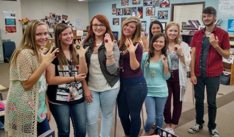 2015-2016 staff members during the annual commitment ceremony. Each year the entire staff pledges to produce quality work on both the online newspaper and yearbook. Staff members are, from left, Cadyn Qualls, Shyla Clayton, Lexie Ray, Kensie Walker, Stephanie Atchley, Joanna Perez, MJ Ivy and Camden Metheny