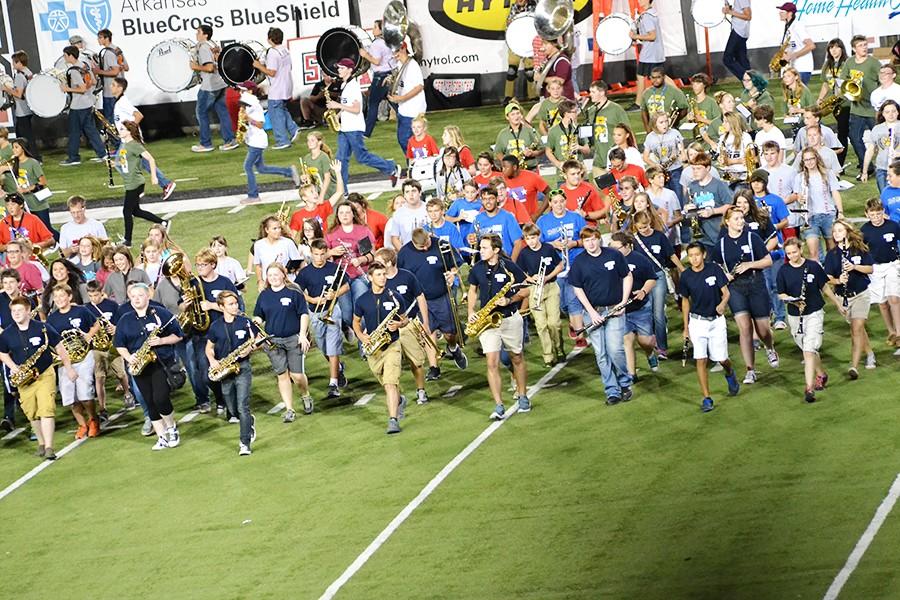 Band members take the field during the halftime of Saturdays ASU Red Wolves game.