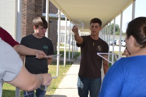 Students in Mandy McFalls science classes recently did outdoor experiments with handmade bubble wands and solution. McFalls 2015 biology students have recently been recognized for their performance on the EOC. Pictured are, from left, Chase Ellis, Hunter Drury and Hannah Harrell.