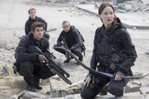 Liam Hemsworth, Sam Claflin, Evan Ross and Jennifer Lawrence in The Hunger Games: Mockingjay, Part 2.