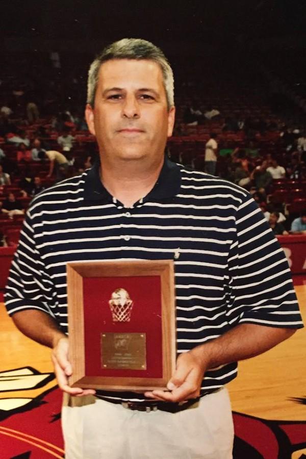 Taylor receiving the Arkansas High School Coaches Association Basketball Coach of the Year award in 2006.