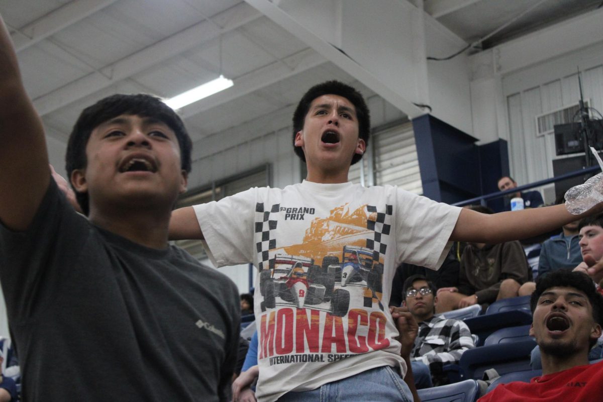 Bryan Aleman, Humberto Galvan, and Junior Vasquez get energized about a call during the annual Blue and Gray game.